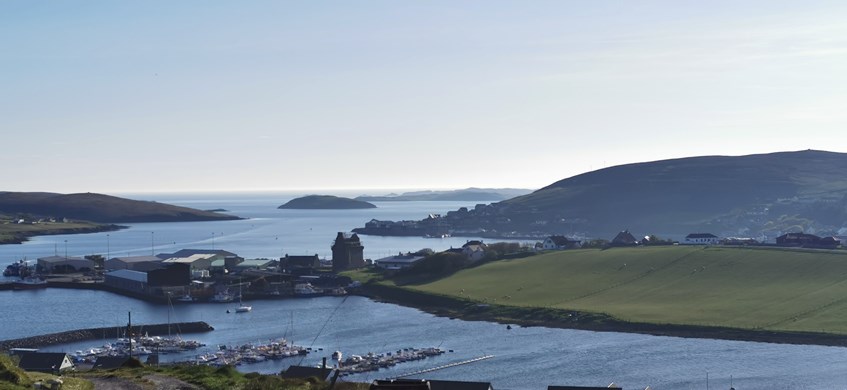 A coastal landscape and village.