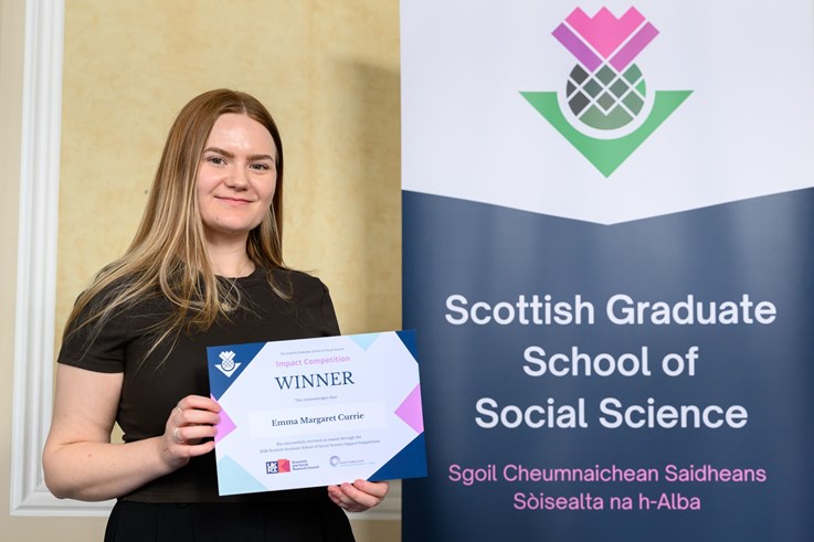 PhD student Emma Margaret Currie with her Planned Impact Award